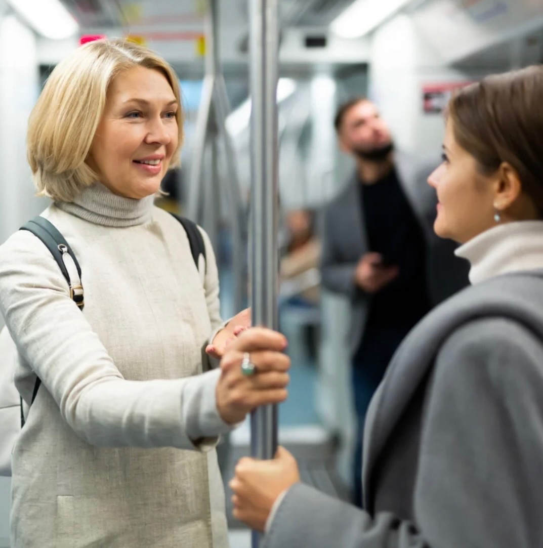 People engaged in face to face conversation